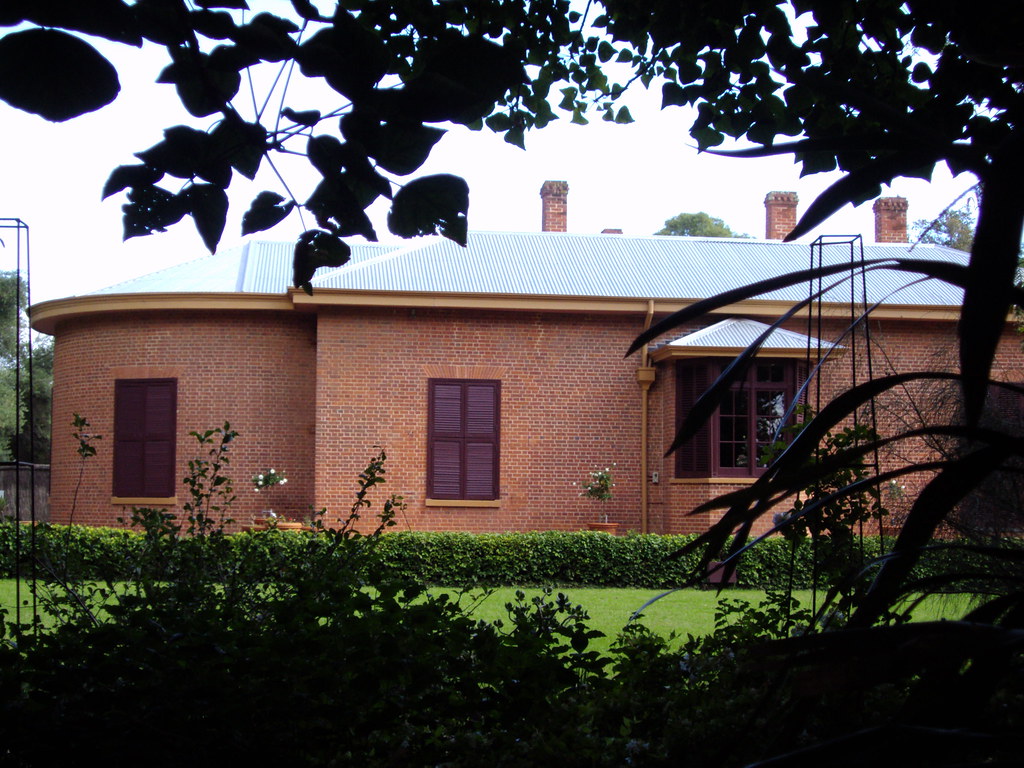 Beautiful colonial-style home with elegant roof architecture